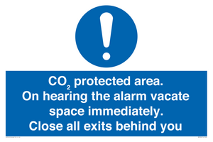 MN7906: CO₂ protected area. On hearing the alarm vacate space immediately. Close all exits behind you