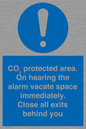 MN7906: CO₂ protected area. On hearing the alarm vacate space immediately. Close all exits behind you