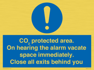 MN7906: CO₂ protected area. On hearing the alarm vacate space immediately. Close all exits behind you