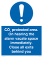 MN7906: CO₂ protected area. On hearing the alarm vacate space immediately. Close all exits behind you
