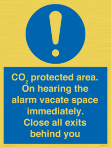 MN7906: CO₂ protected area. On hearing the alarm vacate space immediately. Close all exits behind you