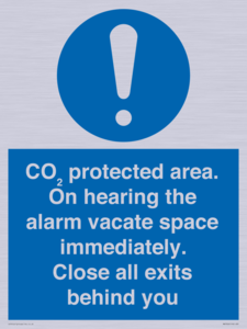 MN7906: CO₂ protected area. On hearing the alarm vacate space immediately. Close all exits behind you