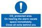 MN7906: CO₂ protected area. On hearing the alarm vacate space immediately. Close all exits behind you