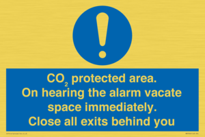 MN7906: CO₂ protected area. On hearing the alarm vacate space immediately. Close all exits behind you