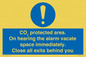 MN7906: CO₂ protected area. On hearing the alarm vacate space immediately. Close all exits behind you