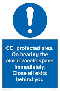 MN7906: CO₂ protected area. On hearing the alarm vacate space immediately. Close all exits behind you