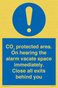 MN7906: CO₂ protected area. On hearing the alarm vacate space immediately. Close all exits behind you