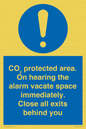 MN7906: CO₂ protected area. On hearing the alarm vacate space immediately. Close all exits behind you