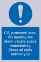 MN7906: CO₂ protected area. On hearing the alarm vacate space immediately. Close all exits behind you