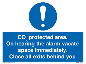 MN7906: CO₂ protected area. On hearing the alarm vacate space immediately. Close all exits behind you