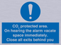 MN7906: CO₂ protected area. On hearing the alarm vacate space immediately. Close all exits behind you