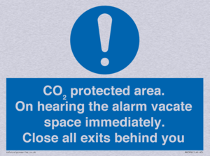 MN7906: CO₂ protected area. On hearing the alarm vacate space immediately. Close all exits behind you