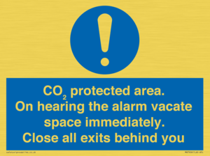 MN7906: CO₂ protected area. On hearing the alarm vacate space immediately. Close all exits behind you