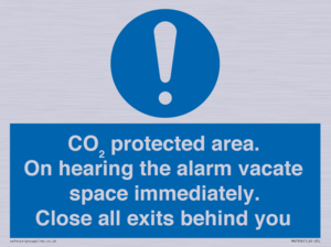 MN7906: CO₂ protected area. On hearing the alarm vacate space immediately. Close all exits behind you