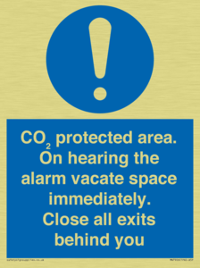 MN7906: CO₂ protected area. On hearing the alarm vacate space immediately. Close all exits behind you