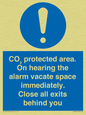 MN7906: CO₂ protected area. On hearing the alarm vacate space immediately. Close all exits behind you