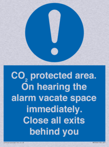 MN7906: CO₂ protected area. On hearing the alarm vacate space immediately. Close all exits behind you