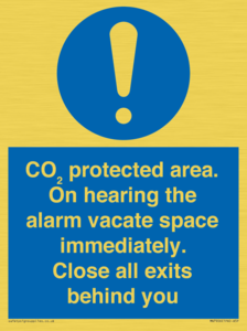 MN7906: CO₂ protected area. On hearing the alarm vacate space immediately. Close all exits behind you