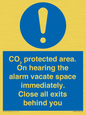 MN7906: CO₂ protected area. On hearing the alarm vacate space immediately. Close all exits behind you
