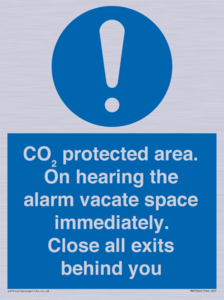 MN7906: CO₂ protected area. On hearing the alarm vacate space immediately. Close all exits behind you