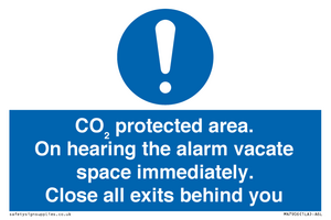 MN7906: CO₂ protected area. On hearing the alarm vacate space immediately. Close all exits behind you