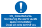 MN7906: CO₂ protected area. On hearing the alarm vacate space immediately. Close all exits behind you
