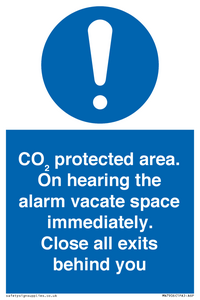 MN7906: CO₂ protected area. On hearing the alarm vacate space immediately. Close all exits behind you