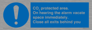 MN7906: CO₂ protected area. On hearing the alarm vacate space immediately. Close all exits behind you