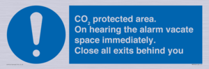 MN7906: CO₂ protected area. On hearing the alarm vacate space immediately. Close all exits behind you