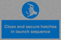 MV7520: Close and secure hatches in launch sequence