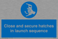 MV7520: Close and secure hatches in launch sequence