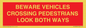 PR12804: BEWARE VEHICLES CROSSING (PEDESTRAINS LOOK BOTH WAYS)