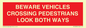 PR12804: BEWARE VEHICLES CROSSING (PEDESTRAINS LOOK BOTH WAYS)