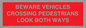 PR12804: BEWARE VEHICLES CROSSING (PEDESTRAINS LOOK BOTH WAYS)
