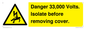 WE12404: Danger 33,000 Volts. Isolate before removing cover.