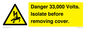 WE12404: Danger 33,000 Volts. Isolate before removing cover.