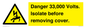 WE12404: Danger 33,000 Volts. Isolate before removing cover.